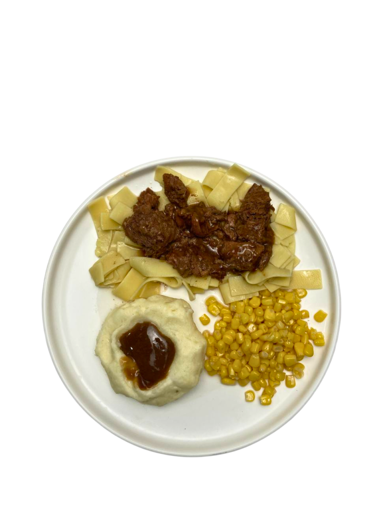 BEEF TIPS AND EGG NOODLES ON PLATE