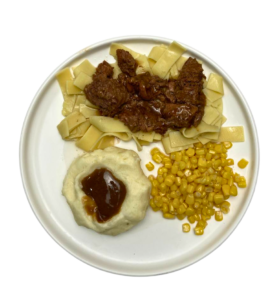 BEEF TIPS AND EGG NOODLES ON PLATE